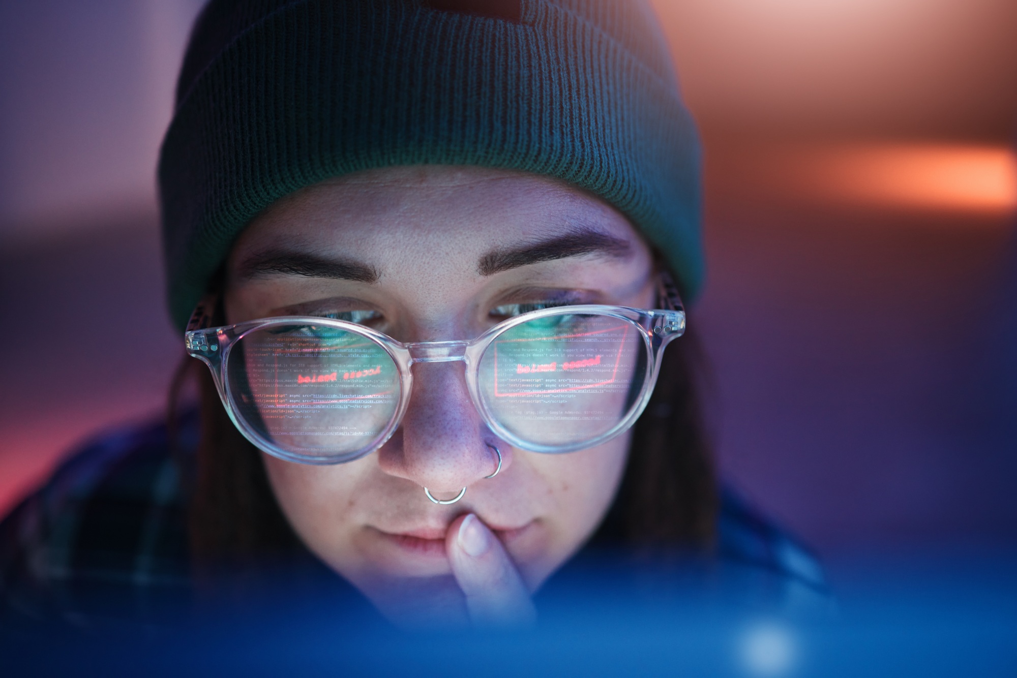 Cyber security, ransomware and woman hacker working on a computer in the basement at night for phis