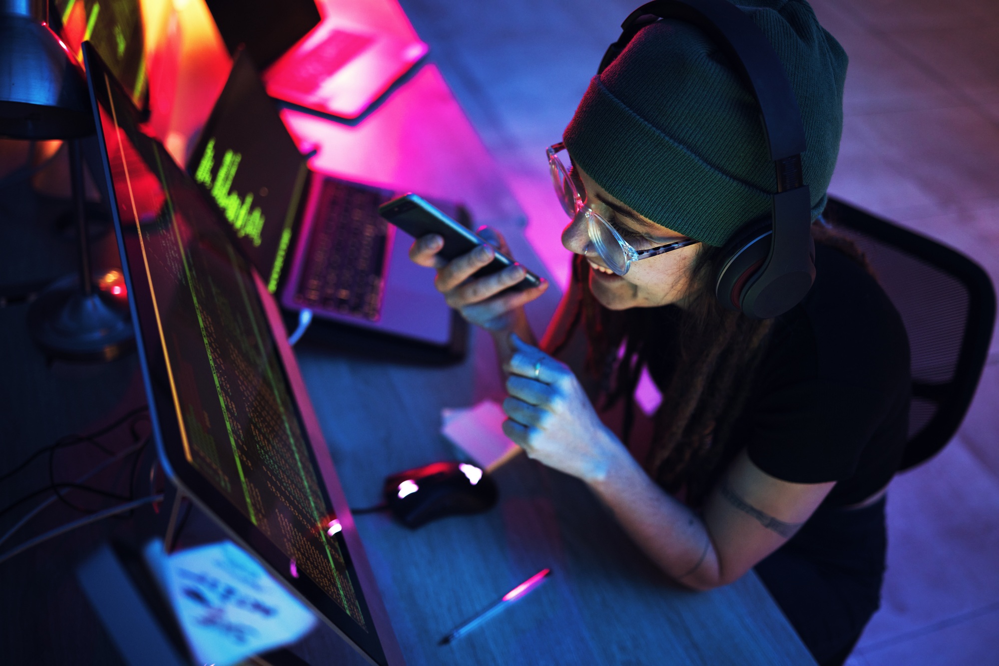 Night, phone call or woman hacker by computer screen in dark room for hacking, phishing or cybersec