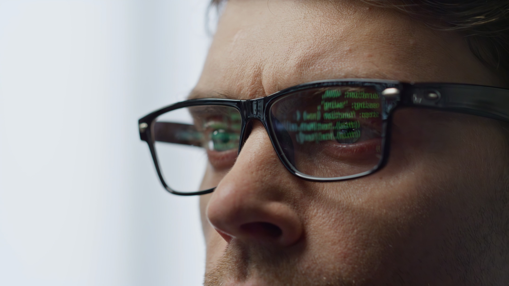 Software developer glasses reflecting terminal code closeup. It man hacker work